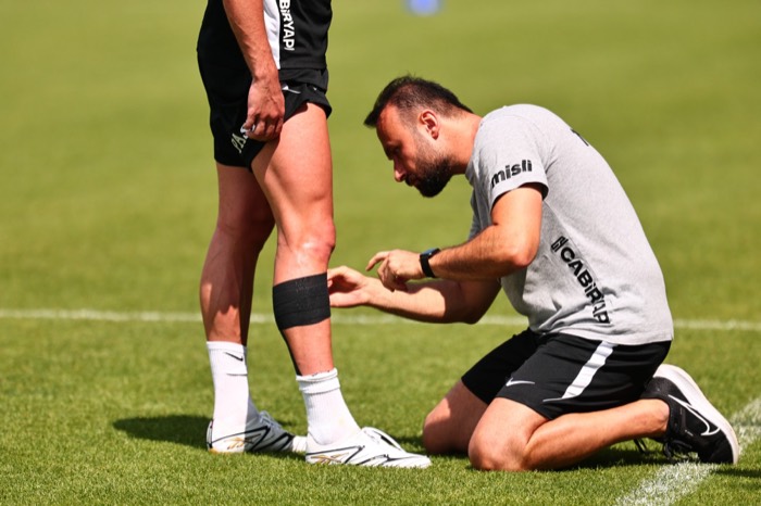 Taping an athlete on the pitch